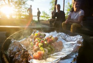 While sitting around an outside fire over conjures up images of roasting marshmallows to make tasty treats, there are many other things you can cook over a fire with your family.