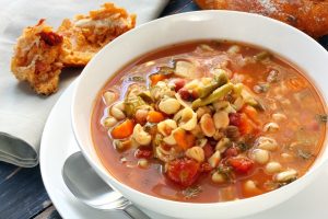 One of my favorite late summer recipes is making homemade minestrone soup. Made from garden favorites like vine-ripened tomatoes, ears of corn, zucchini, green beans, and fresh herbs, this soup celebrates summer!