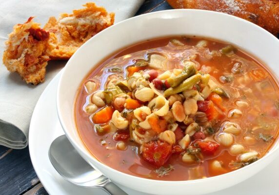 One of my favorite late summer recipes is making homemade minestrone soup. Made from garden favorites like vine-ripened tomatoes, ears of corn, zucchini, green beans, and fresh herbs, this soup celebrates summer!