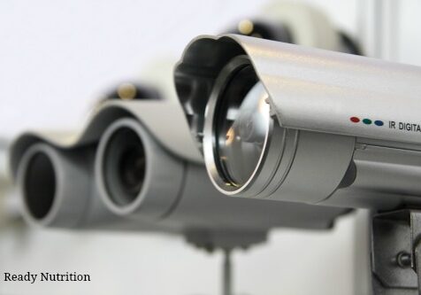 CCTV security cams on white wall background.