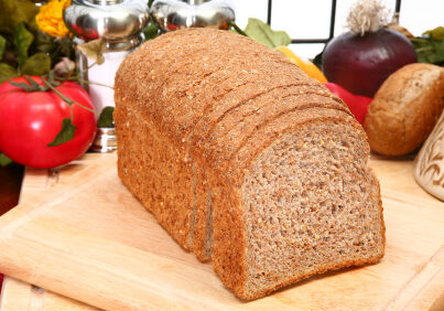 Ezekiel or Sprouted Wheat  whole grain flourless Bread in kitchen or restaurant.