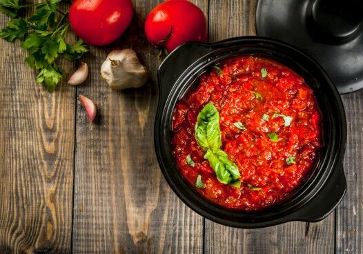 Enjoy the bounty of summer-fresh vegetables with this canning guide on making delicious marinara sauce. 