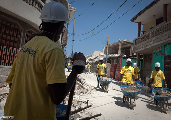 PORT-AU-PRINCE, HAITI - MARCH 30: Workers hired by the Haitian government clear debris from earthquake-damaged homes March 30, 2010 in the Bel Air section of Port-au-Prince, Haiti.  (Photo by Lee Celano/Getty Images)